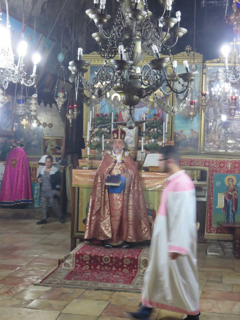33 Armenian priest at Tomb AN ARMENIAN PRIEST